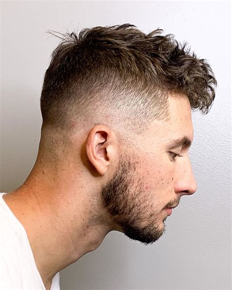 Wavy Top High Fade. For a wavy and curly hair structure, any kind of fade is a real godsend, as it allows concentrating attention on your top hair while keeping the unruly locks tamed. For extra boldness and sharpness of the look, you can dye your mens hairstyles to make them pop against your skin tone. Source: @z_ramsey via Instagram.